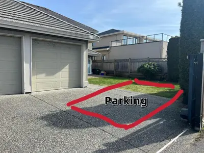 a house with a garage with the words parking at A cozy independent entrance bedroom with a private washroom close to YVR Richmond in Richmond