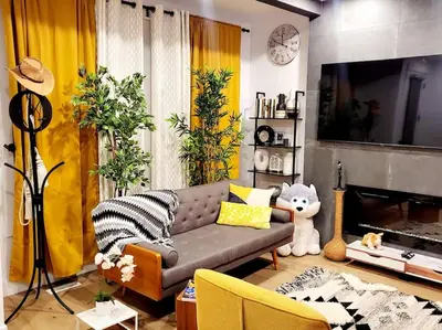 a living room with a couch and a tv at Welcome to Happy Place where Cozy Comfort Meets Exquisite Luxury in Edmonton