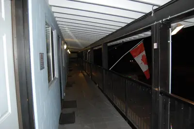an empty hallway with a flag in a building at Rest Inn in Terrace