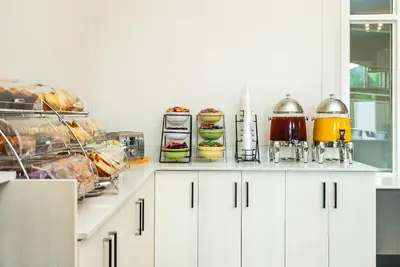 a kitchen with a counter with food on it at Quality Inn & Suites in Clearwater