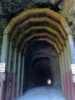 a tunnel in a mountain with a light at the end at Evergreen Bed & Breakfast in Hope