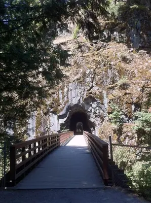 a bridge leading to a tunnel in a mountain at Evergreen Bed & Breakfast in Hope