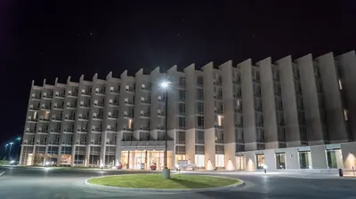a large building at night with a light on it at Grey Eagle Resort in Calgary