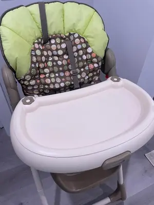 a high chair with a diaper bag on it at Private Chic Modern Suite with Kitchen near Spruce Meadows and LRT in Calgary