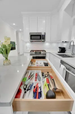 a kitchen counter with a drawer full of tools at Family-Friendly, 3 Bed House - Private Backyard-Central Location in Vancouver
