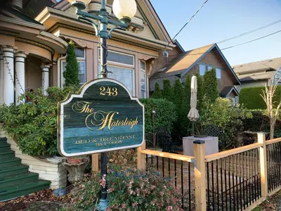 a sign in front of a house at Haterleigh Heritage Inn in Victoria