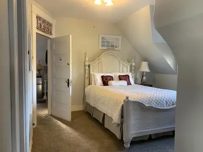 a bedroom with a bed and an attic at Haterleigh Heritage Inn in Victoria