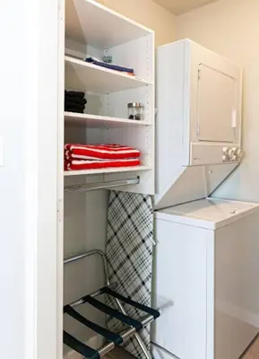 a white refrigerator with a tie in the door at Lovely 2 bedroom suite steps from The beach in Victoria