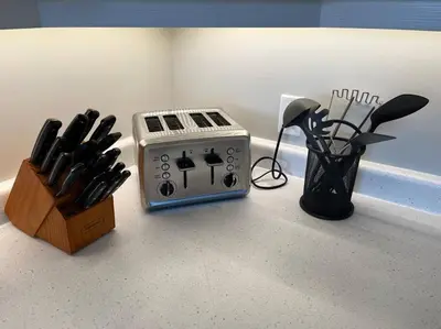 a kitchen counter with a toaster and a knife block at Ocean View Oasis in Campbell River