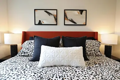 a bedroom with a bed with two lamps at Stylish Home with AC, 3 King Beds, Garage, Disney in Edmonton