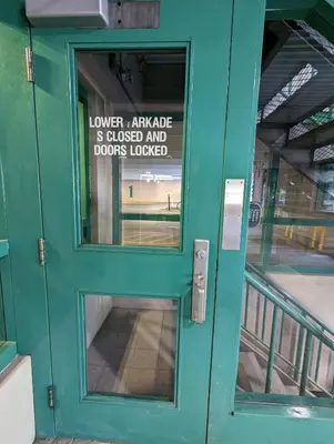 a green door with a sign on it at King Edward Hotel in Banff
