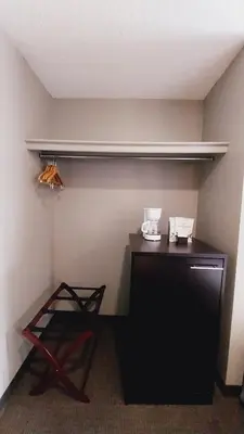 a room with a desk with a shelf on the wall at King Edward Hotel in Banff
