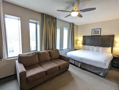 a hotel room with a bed and a couch at King Edward Hotel in Banff