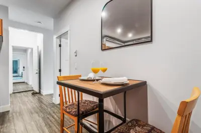 a dining room with a table and two glasses of wine at Heaven's Haven in Vernon