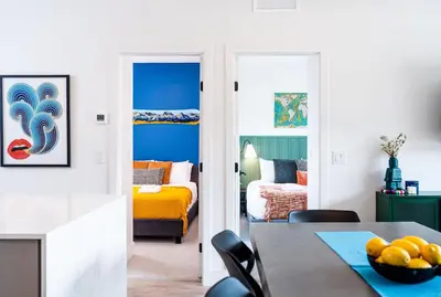 a room with a dining table and a bedroom at The Ski Shanty by Revelstoke Vacations in Revelstoke