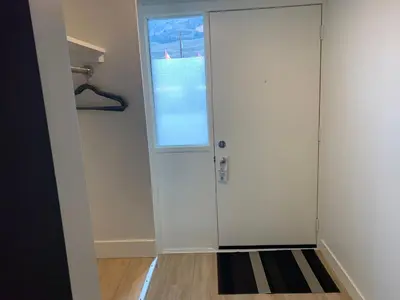 a room with a door and a window at Destination Inn Cache Creek in Cache Creek