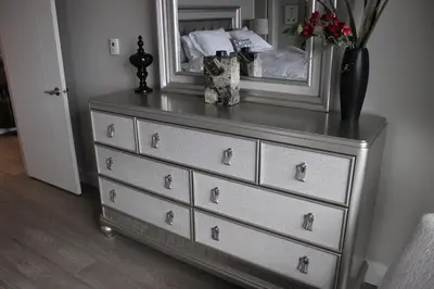 a dresser with a mirror on top of it at EdgeWater Chemainus in Chemainus