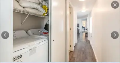 a closet with a washer and dryer in a room at Cosy country mobile home on 18 acres farm sleeps 5 in Port Alberni