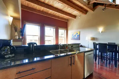 a kitchen with a sink and a counter top at Unique Style 2 Bedroom 2 Bath Condo In Old Town Victoria in Victoria