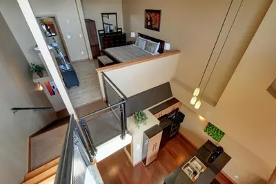an overhead view of a staircase in a house at Unique Style 2 Bedroom 2 Bath Condo In Old Town Victoria in Victoria
