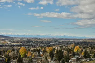 a view of a city with trees and buildings at Alt Hotel Calgary University District in Calgary