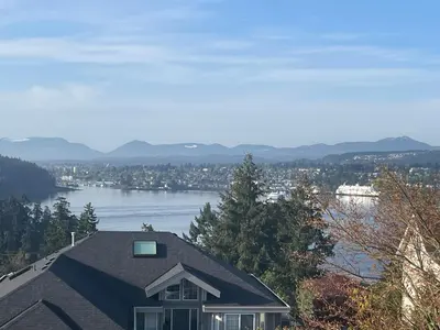 a house with a view of a body of water at Panoramic Ocean View in Nanaimo