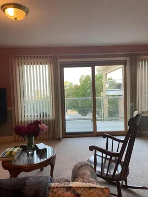 a living room with a couch and a table at Panoramic Ocean View in Nanaimo