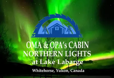 a sign for the naac and otas cabin northern lights at lake la at Oma's and Opa's Northern Lights Viewing Cabin in Whitehorse