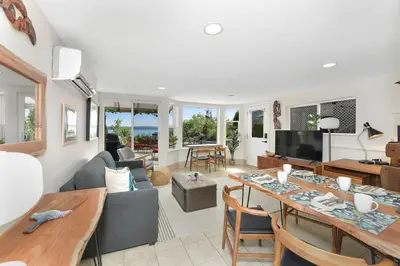a living room with a table and chairs and a couch at Gulf Island View Suite by EMR Vacation Rentals in Chemainus