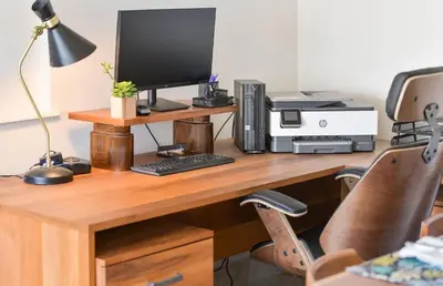 a desk with a computer monitor and a printer at Gulf Island View Suite by EMR Vacation Rentals in Chemainus