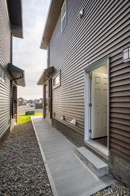 a building with a walkway between two buildings at Luxurious Comfortable Suite in Airdrie