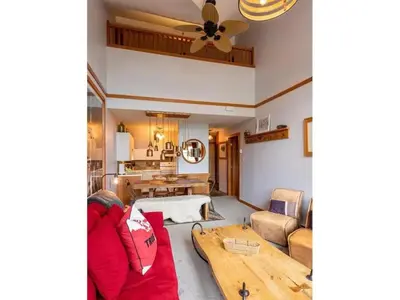 a living room with a couch and a table at Glacier Lodge Steps to Trails and Nature in Whistler