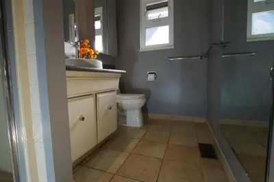 a bathroom with a toilet and a sink and a shower at New Master room & private washroom 203 in Richmond