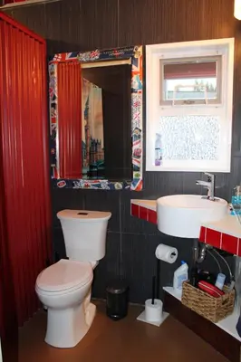 a bathroom with a toilet and a sink at Private Bright Modern Studio! Queen bed ! in Victoria