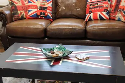 a coffee table in front of a couch with a bowl on it at Private Bright Modern Studio! Queen bed ! in Victoria