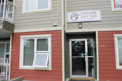 a building with a sign that reads discovery suites at Discovery Suite in Yellowknife