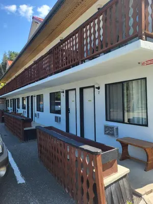 a row of benches on the side of a building at Alpen Motel in Radium Hot Springs