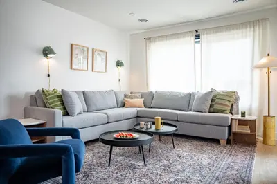 a living room with a couch and a table at Cabot Views by Revelstoke Vacations in Revelstoke