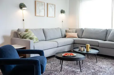 a living room with a couch and a table at Cabot Views by Revelstoke Vacations in Revelstoke