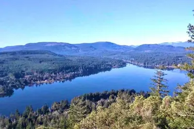 a view of a lake in the mountains at RainCoast Retreat at Shawnigan Lake! in Shawnigan Lake