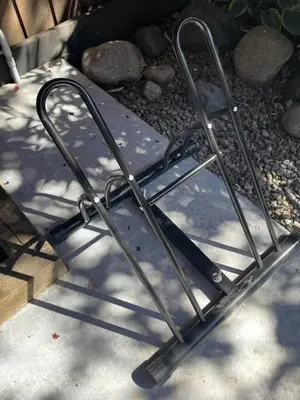 a metal folding chair sitting on the ground at RainCoast Retreat at Shawnigan Lake! in Shawnigan Lake
