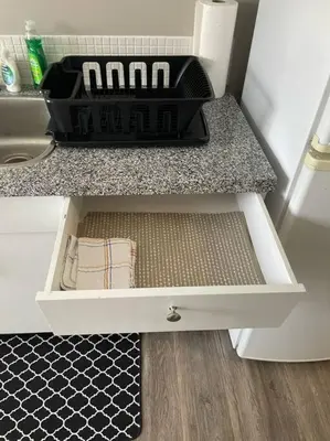 a drawer in a kitchen with a sink at Exquisite 2 Bedroom Apartment in Camrose