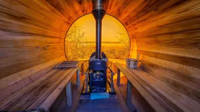 an inside view of a sauna with two benches at Refuge Bay's Aqua Tiny Home - Luxury Off Grid Escape in Cherhill