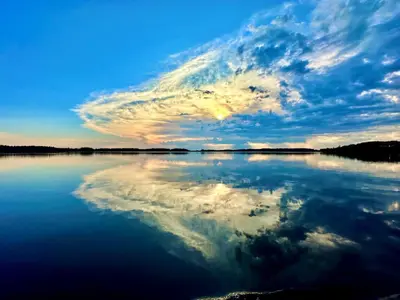 a large body of water with a cloudy sky at Refuge Bay's Aqua Tiny Home - Luxury Off Grid Escape in Cherhill