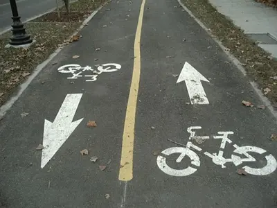 a bike lane with arrows on the road at Beds By the Bridge in Kelowna