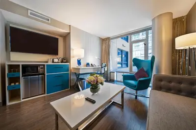 a living room with a couch and a table at Hotel BLU in Vancouver