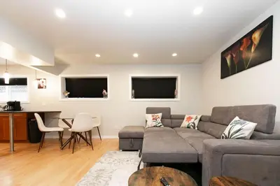 a living room with a couch and a table at Lovely 1 Bedroom Suite Near Town in Victoria