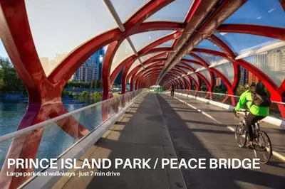 a person riding a bike on a bridge at LUXURY Downtown Sunset Getaway - Your Home Away From Home - Fully Stocked Kitchen, Gym, Balcony, FREE PARKING in Calgary