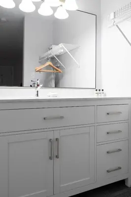a bathroom with a white sink and a large mirror at Copper Mountain Inn and Suites in Princeton
