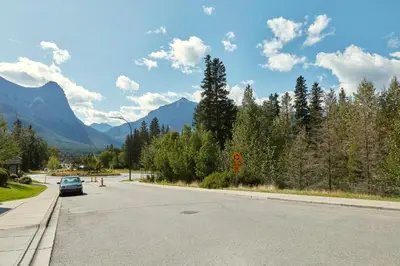 a car parked on the side of a road at Spacious King Bed with Pool & Hot Tubs in Canmore
